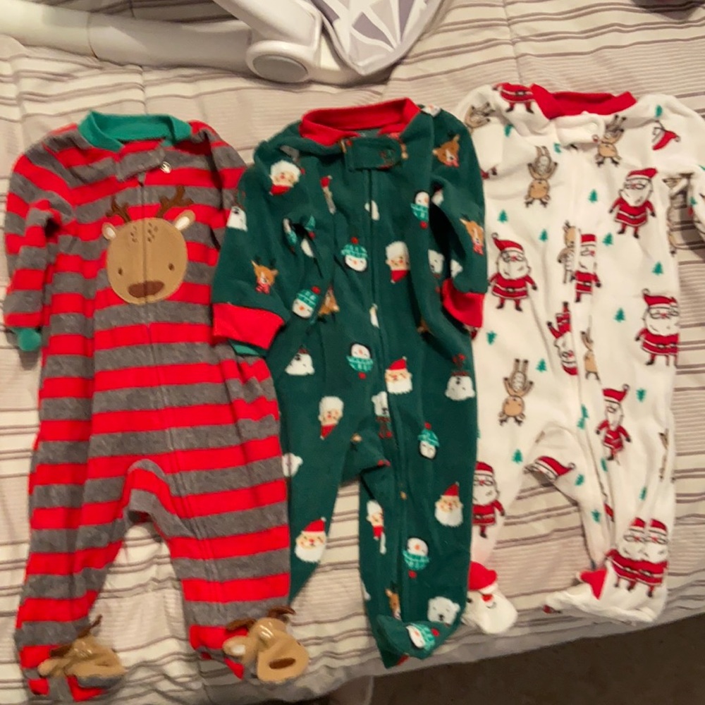 Carter’s 3 month Christmas sleepers. All zip